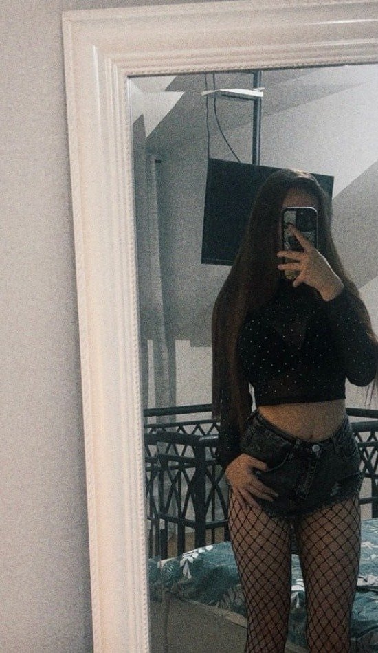 Brunette creator in a black look with fishnets for the hottest brunette lingerie creators page
